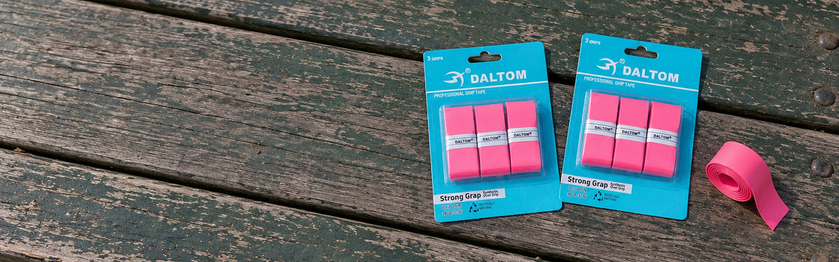 Daltom overgrip packs on a wooden bench