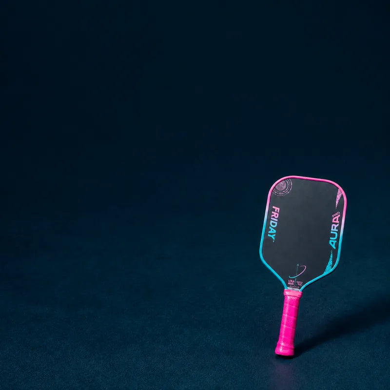 Friday Aura Pro paddle on a dark court surface