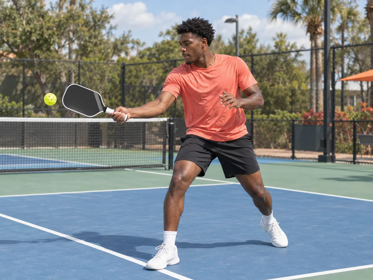 Player hitting a forehand with a JOOLA Perseus paddle
